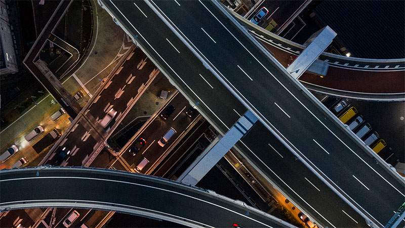 Aerial view of intersecting highways in a city, used to illustrate the Marubeni Corporation case study.