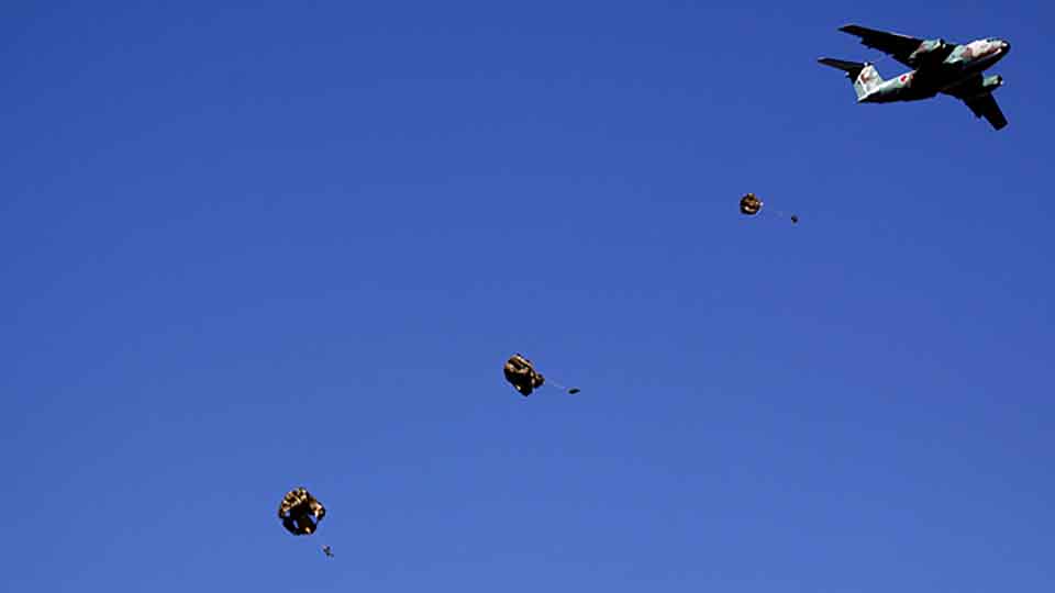 Troops from the Japan's Ground Self-Defense Force 1st Airborne Brigade dive from a C-1 transport plane during an annual new year military exercise in Narashino, east of Tokyo January 11, 2009.