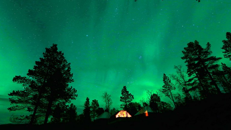 Our World : An Aurora Borealis (Northern Lights) is seen over a mountain camp north of the Arctic Circle, near the village of Mestervik late September 30, 2014.