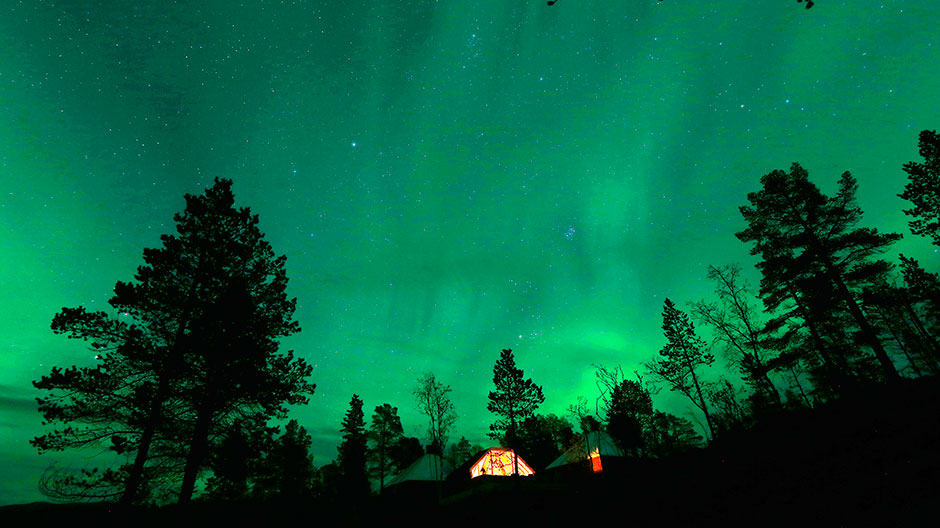 Our World : An Aurora Borealis (Northern Lights) is seen over a mountain camp north of the Arctic Circle, near the village of Mestervik late September 30, 2014.