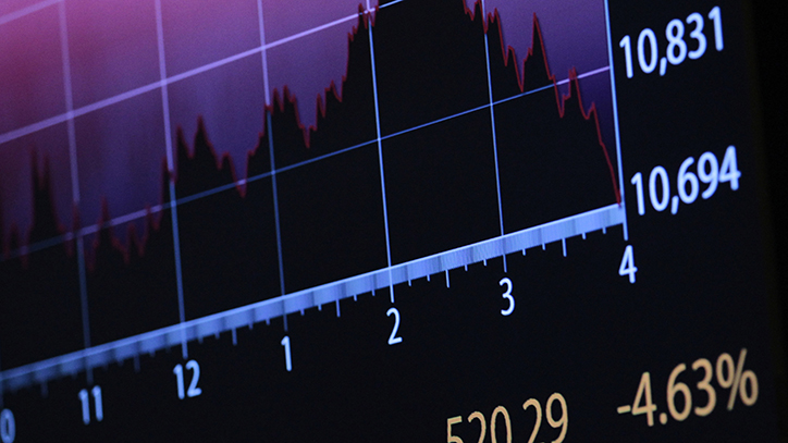 A screen displays the final numbers for the Dow Jones Industrial Average on the floor of the New York Stock Exchange, August 10, 2011.